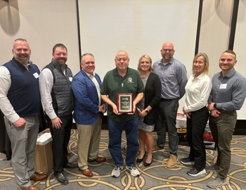 Elwyne Powers and Members of the Athletic Department.