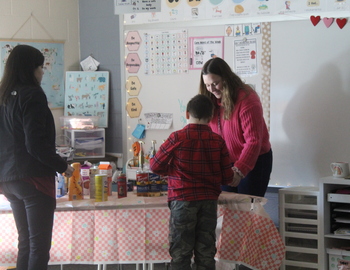 2 staff and 1 student making coffee