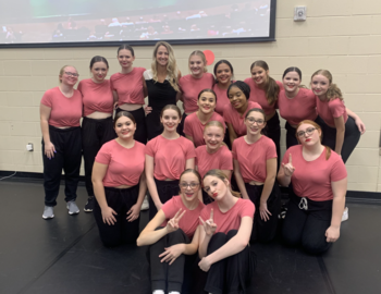 Mrs. Hill with 17 students in pink shirts
