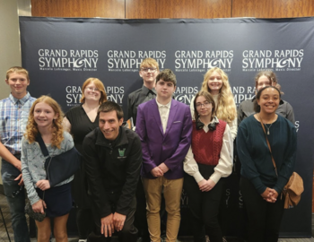 Members from MS and HS orchestra with Mr. Hosler