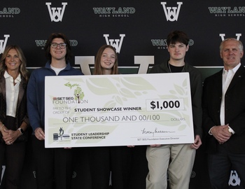 2 representatives from SET SEG, 3 high school students, and the check