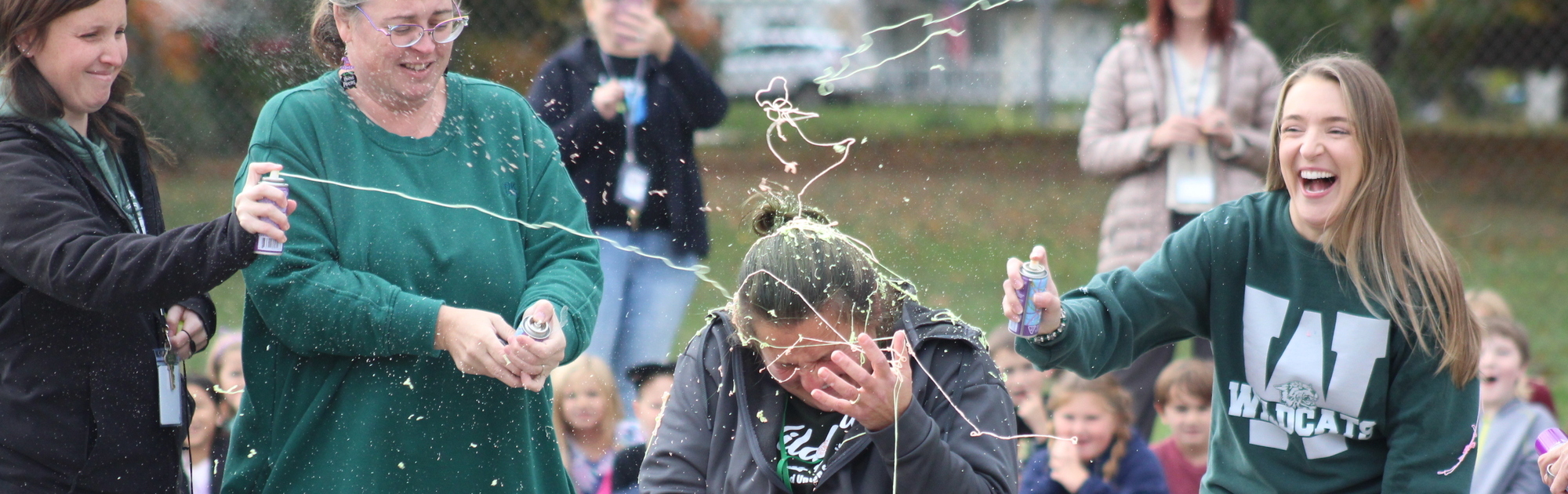 Teachers silly stringing Karri Bailey as a reward for the students