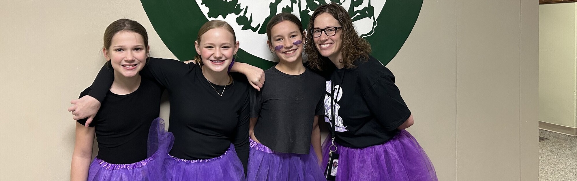 PS students and staff in purple